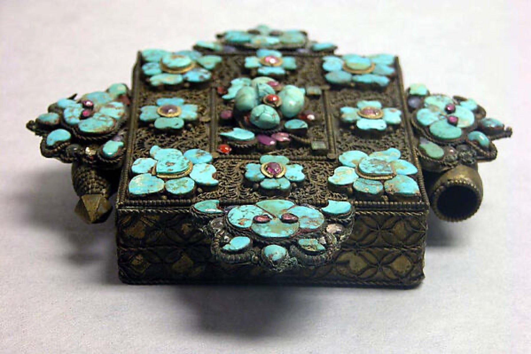 Tibetan gold amulet case set with stones